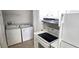 Efficient kitchen area with standard appliances, washer and dryer hookups, and ample counter space at 1024 Spring Meadow Dr, Kissimmee, FL 34741