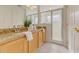Bathroom featuring double sinks, granite countertops, and a glass-enclosed shower at 1101 Marcello Blvd, Kissimmee, FL 34746