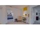 Bright bedroom features an open doorway and cozy decor with a comfortable chair and bedside table at 1101 Marcello Blvd, Kissimmee, FL 34746