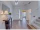 Welcoming foyer with wood floors, staircase, and a decorative table, creating an inviting entrance at 1101 Marcello Blvd, Kissimmee, FL 34746