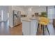Bright kitchen features granite countertops, white cabinets, and a stainless steel refrigerator at 1101 Marcello Blvd, Kissimmee, FL 34746