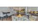 Open-concept living room featuring hardwood floors and lots of natural light at 1101 Marcello Blvd, Kissimmee, FL 34746