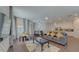 Open-concept living room featuring hardwood floors and lots of natural light at 1101 Marcello Blvd, Kissimmee, FL 34746