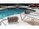 Relaxing poolside with lounge chairs and towels near a beautiful in-ground pool and jacuzzi at 1101 Marcello Blvd, Kissimmee, FL 34746