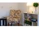 Sitting area features chair, small table, shelf and carpeted floor at 1101 Marcello Blvd, Kissimmee, FL 34746