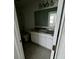 An empty bathroom featuring a vanity, toilet, tub, and tiled flooring at 1140 Merrill St, Davenport, FL 33837