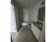 Bathroom with tile floors, vanity with granite top, and tub/shower combo at 1140 Merrill St, Davenport, FL 33837