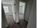 An empty bedrooms with neutral walls and flooring and large windows at 1140 Merrill St, Davenport, FL 33837