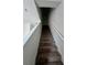 Carpeted staircase with white railing leading to the upper level at 1140 Merrill St, Davenport, FL 33837