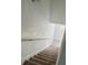 Carpeted stairway with handrail leading to the upper level of home at 1140 Merrill St, Davenport, FL 33837