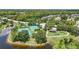 An aerial view showcasing the community's recreational facilities including tennis courts, a basketball court, and a playground at 14006 Yellow Wood Cir, Orlando, FL 32828