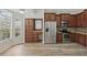 Eat-in kitchen area features updated stainless appliances, custom cabinetry, and natural light at 14006 Yellow Wood Cir, Orlando, FL 32828