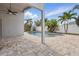 A covered patio gives views of the private pool and outdoor living area at 14006 Yellow Wood Cir, Orlando, FL 32828