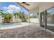 The covered patio overlooks a private pool and a well-manicured backyard oasis at 14006 Yellow Wood Cir, Orlando, FL 32828