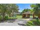 Community playground with a colorful play structure, swing set, picnic shelter, and accessible parking space at 14006 Yellow Wood Cir, Orlando, FL 32828