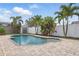 A private in-ground pool with a paved patio and a storage shed surrounded by landscaping at 14006 Yellow Wood Cir, Orlando, FL 32828