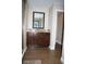 Bathroom including a granite countertop, wood cabinets, and glass enclosed shower at 18805 Nettleton St, Orlando, FL 32833