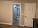 En suite bathroom entryway with tile floor and open access to shower at 18805 Nettleton St, Orlando, FL 32833
