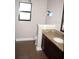 Bathroom featuring granite countertops, a sink, and a mirror, providing a clean and functional space at 18805 Nettleton St, Orlando, FL 32833