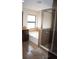Bathroom showcasing a garden tub, enclosed shower, and dark wood cabinets at 18805 Nettleton St, Orlando, FL 32833