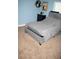 Comfortable bedroom with a gray bed, dresser, and ample space, offering a relaxing and inviting atmosphere at 18805 Nettleton St, Orlando, FL 32833