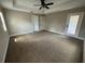 A light filled bedroom with ample open floor space and an overhead fan at 18805 Nettleton St, Orlando, FL 32833
