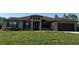 Beautiful one-story home with dark brown shutters and attached two car garage at 18805 Nettleton St, Orlando, FL 32833