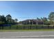 Charming one-story home with a well-maintained lawn and black wooden fence at 18805 Nettleton St, Orlando, FL 32833