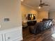 Spacious living room featuring hardwood floors, vaulted ceilings, and modern entertainment center at 18805 Nettleton St, Orlando, FL 32833
