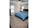 Spacious main bedroom featuring a ceiling fan, two windows, and ample space, creating a serene and inviting retreat at 18805 Nettleton St, Orlando, FL 32833