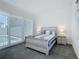 Bedroom with patio access and ensuite bathroom at 235 Hampton Loop, Davenport, FL 33837