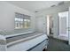 Bright bedroom features a window and ensuite bathroom at 235 Hampton Loop, Davenport, FL 33837