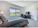 Bedroom has a large window overlooking a green field at 235 Hampton Loop, Davenport, FL 33837