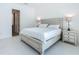 Serene bedroom featuring neutral tones, soft lighting, and a comfortable ambiance with a view to the side yard at 235 Hampton Loop, Davenport, FL 33837