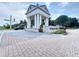 Community Entrance with columns, landscaping and signage at 235 Hampton Loop, Davenport, FL 33837