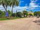 Community Entrance with gate, landscaping, and signage at 235 Hampton Loop, Davenport, FL 33837