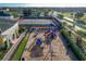 Modern playground featuring a variety of play structures and a safe, cushioned ground surface for to enjoy at 235 Hampton Loop, Davenport, FL 33837