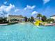 Gathering-friendly pool with splash zone, water slide, and ample space for relaxation and fun at 235 Hampton Loop, Davenport, FL 33837
