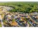Aerial shot of a housing development bordered by forest; the property is highlighted in red at 2520 Jasmine Trace Dr, Kissimmee, FL 34758