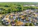 An aerial view of a residential community surrounded by lush greenery and trees at 2520 Jasmine Trace Dr, Kissimmee, FL 34758