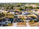 Aerial view of a home, showcasing landscaping, fenced yard, and neighborhood setting at 2520 Jasmine Trace Dr, Kissimmee, FL 34758