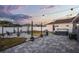 Spacious backyard with hot tub, grill, string lights, seating, and patio area for relaxing at 2520 Jasmine Trace Dr, Kissimmee, FL 34758