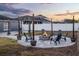 Backyard with a fire pit, string lights, seating, and fence for relaxed outdoor living at 2520 Jasmine Trace Dr, Kissimmee, FL 34758