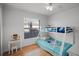 Bright bedroom featuring a bunk bed, natural light, and a charming vanity area at 2520 Jasmine Trace Dr, Kissimmee, FL 34758