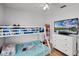 bedroom with a bunk bed, TV, and storage shelf, perfect for a space at 2520 Jasmine Trace Dr, Kissimmee, FL 34758