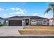 Charming single-story home with a spacious driveway and an attractive, neutral exterior paint scheme at 2520 Jasmine Trace Dr, Kissimmee, FL 34758