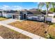 Charming single-story home with a two-car garage, well-kept lawn, and tasteful landscaping at 2520 Jasmine Trace Dr, Kissimmee, FL 34758