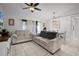 Cozy living room with neutral furniture, tile floors, and ceiling fan at 2520 Jasmine Trace Dr, Kissimmee, FL 34758