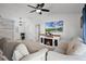 Open living room with electric fireplace, vaulted ceilings, and tile flooring at 2520 Jasmine Trace Dr, Kissimmee, FL 34758