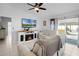 Comfortable living room with fireplace, tile flooring and sliding glass doors to backyard at 2520 Jasmine Trace Dr, Kissimmee, FL 34758